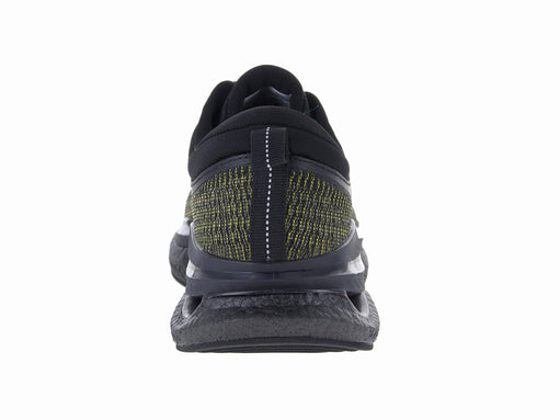 Tenis de baloncesto marca ATOK en color negro con detalles verdes y suela amortiguada.